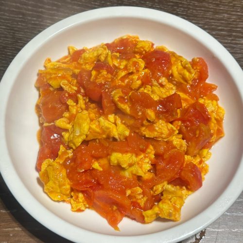 Glossy homestyle tomato and egg stir-fry with fluffy eggs in rich red tomato sauce