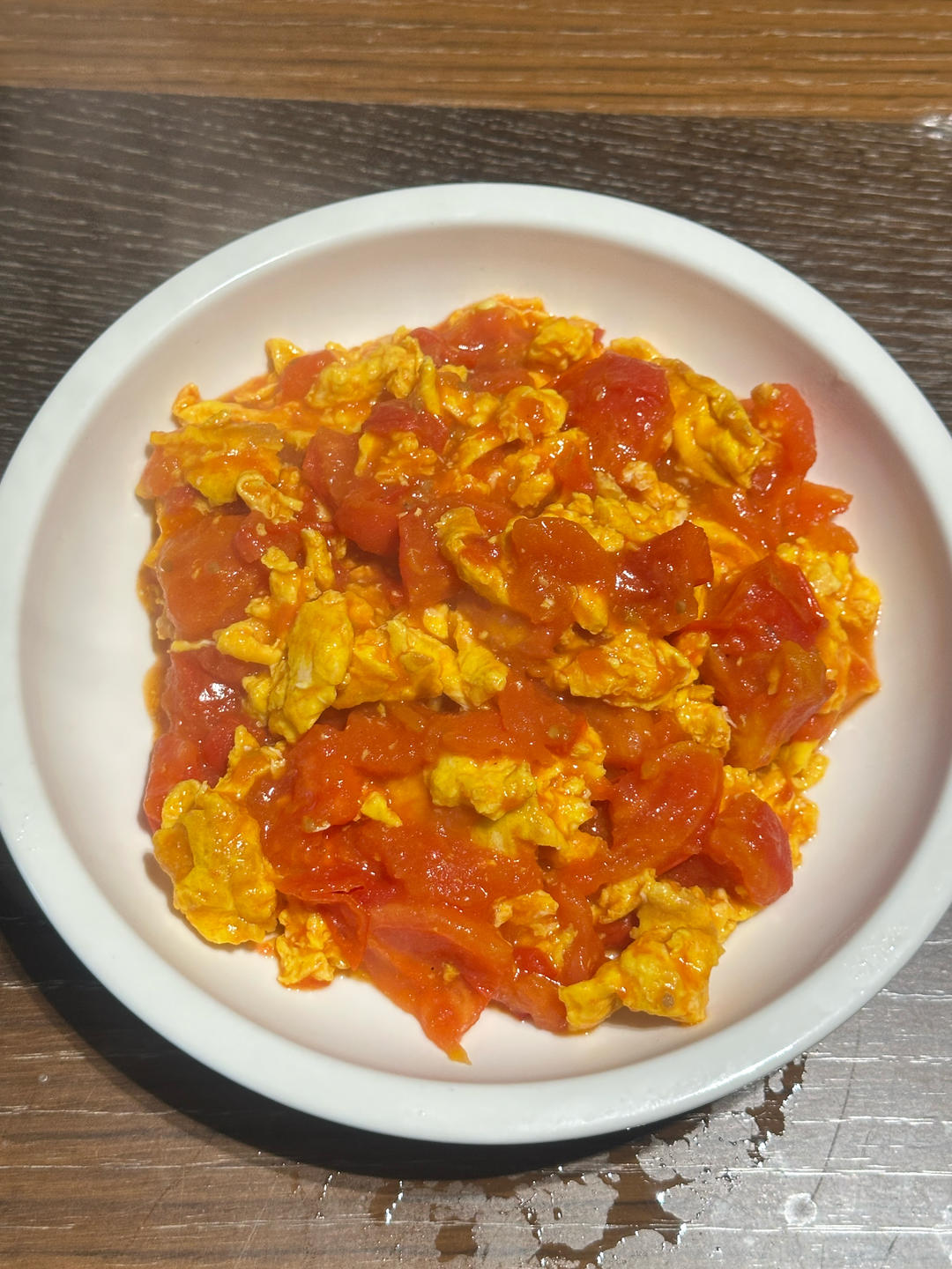 Glossy homestyle tomato and egg stir-fry with fluffy eggs in rich red tomato sauce