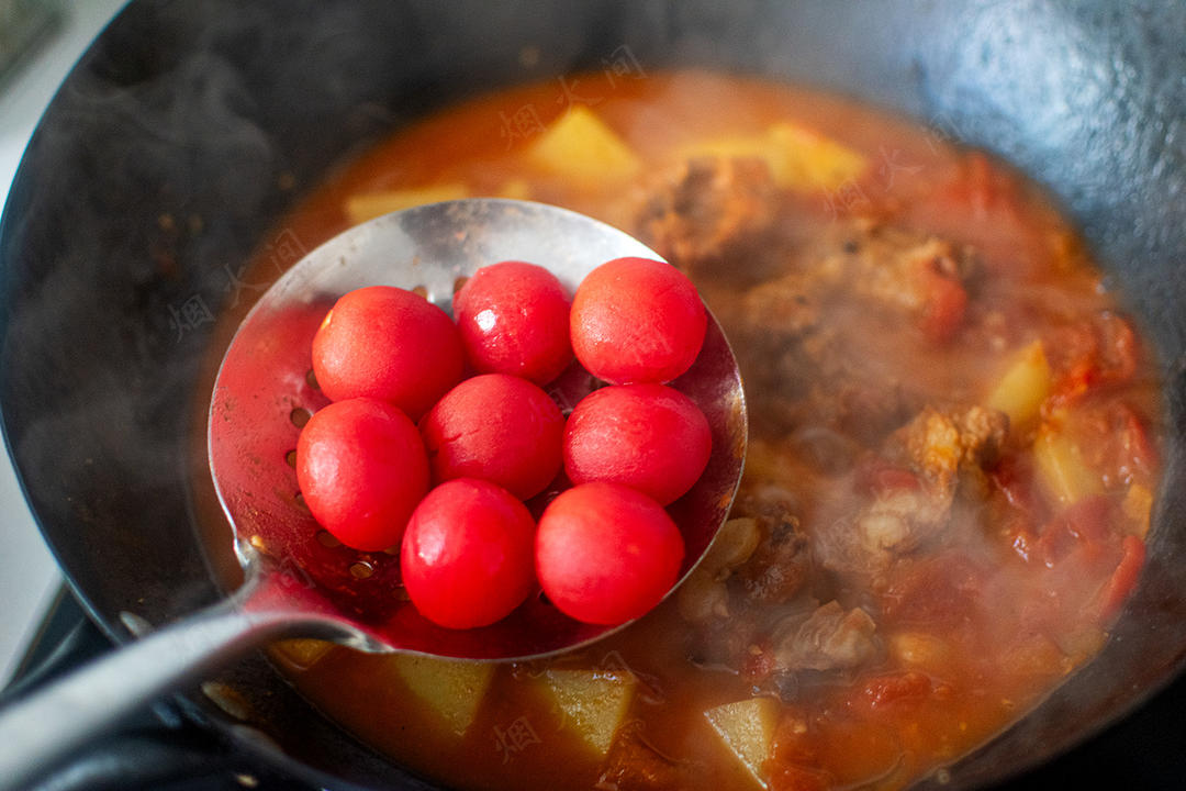 Add the reserved whole tomatoes for the final minutes