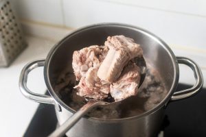Blanch the ribs in cold water and skim the scum