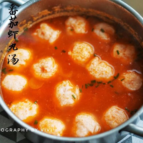 Tomato shrimp ball soup in a bright broth
