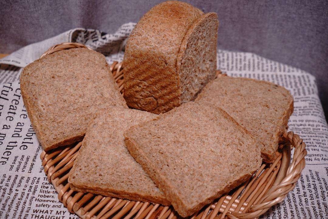 Inspect the soft moist whole wheat crumb studded with visible bran