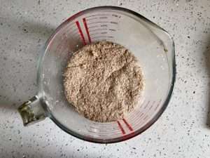 Mix the poolish of whole wheat flour, water, and yeast until no dry flour remains