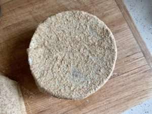 Stretch the dough into a sheet large enough to cover a small bowl
