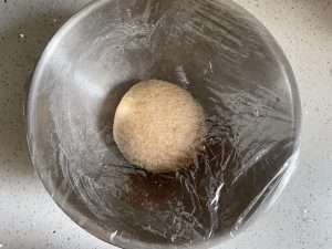 Round the kneaded dough into a ball and cover it for the first proof