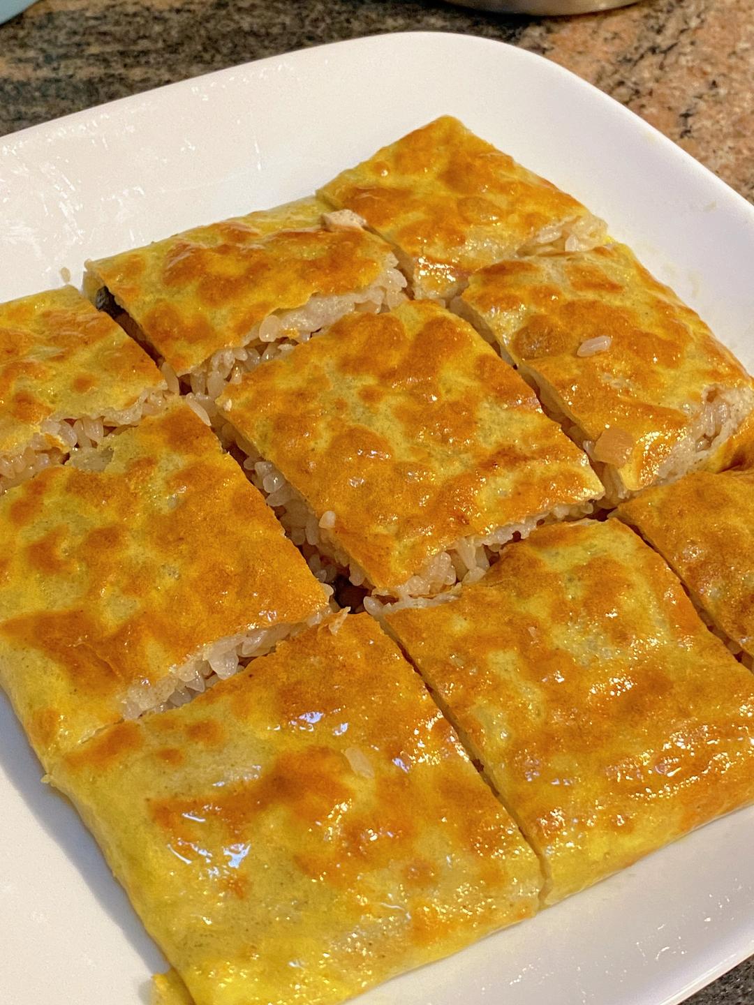 Wuhan San Xian Dou Pi (three-fresh doupi) - crispy mung bean crepe with sticky rice and pork filling