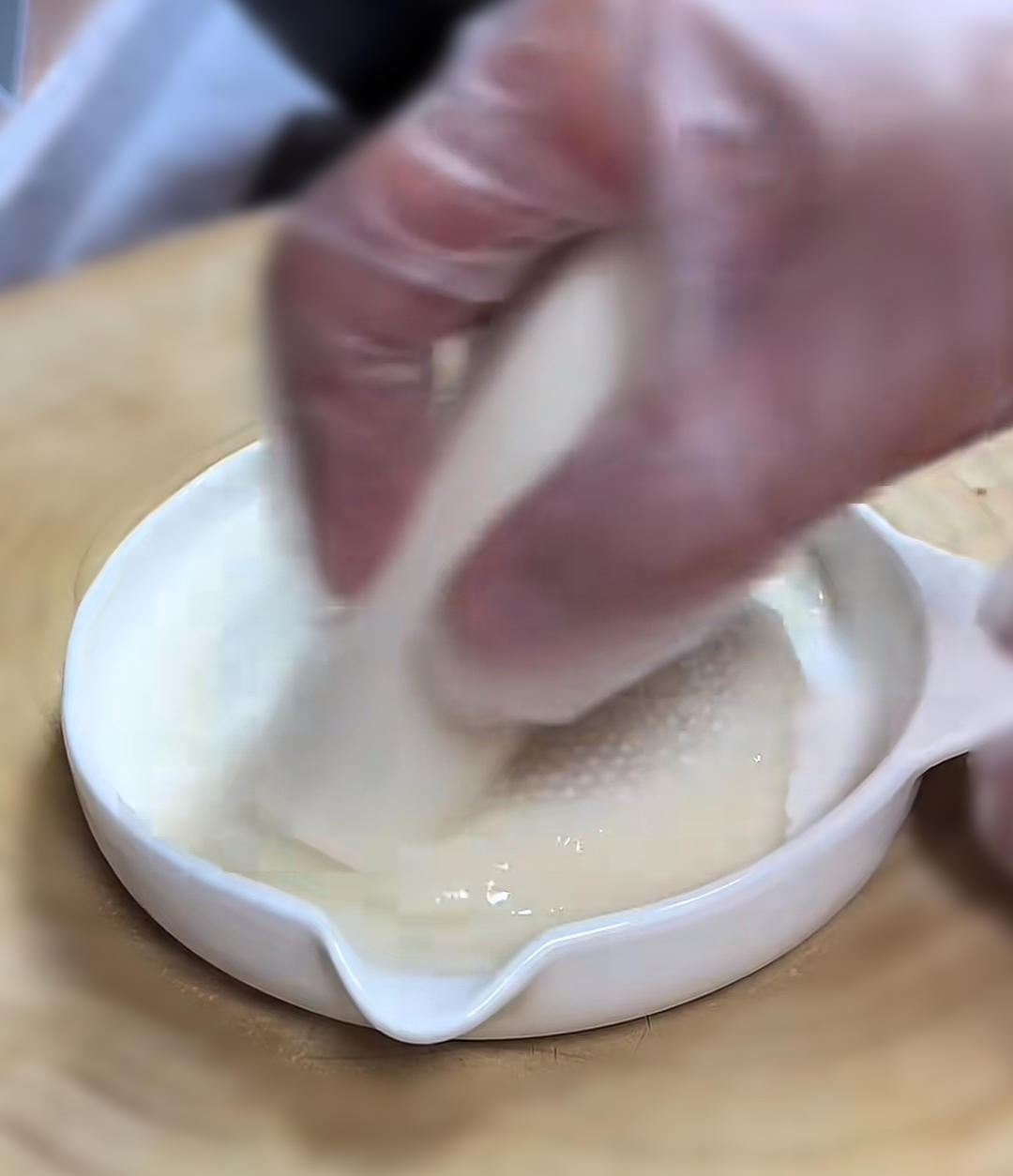 Peel the yam and grate into a paste - many pe
