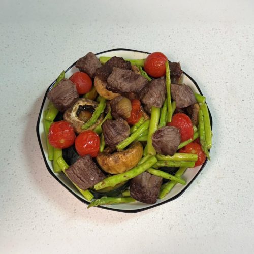 Air fryer beef and roasted vegetables with kabocha pumpkin, mushrooms, asparagus, and cherry tomatoes