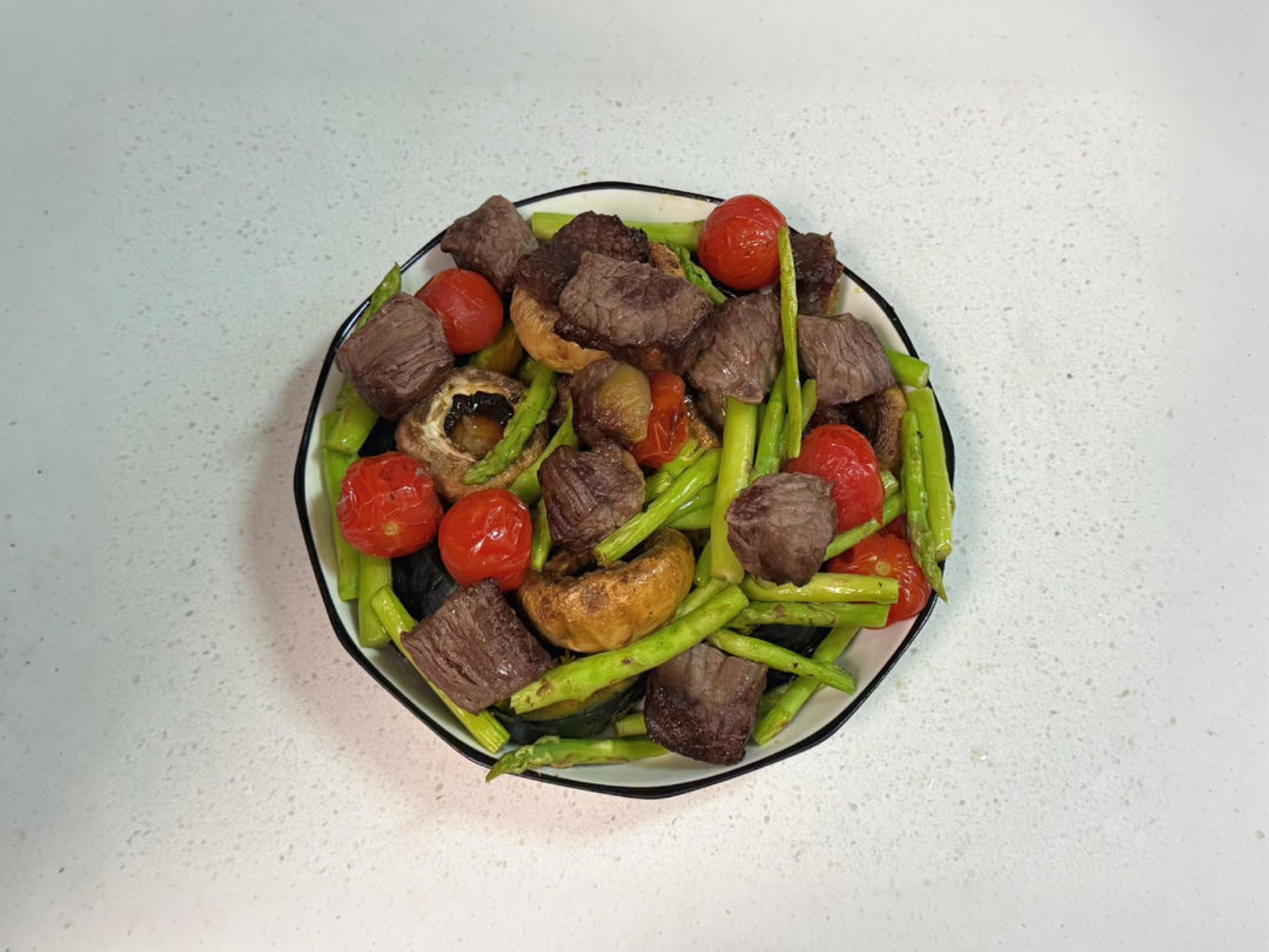 Air fryer beef and roasted vegetables with kabocha pumpkin, mushrooms, asparagus, and cherry tomatoes