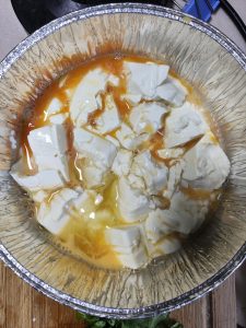 Pour the beaten egg over the tofu and air fry at 180°C (355°F) for 10 minutes.