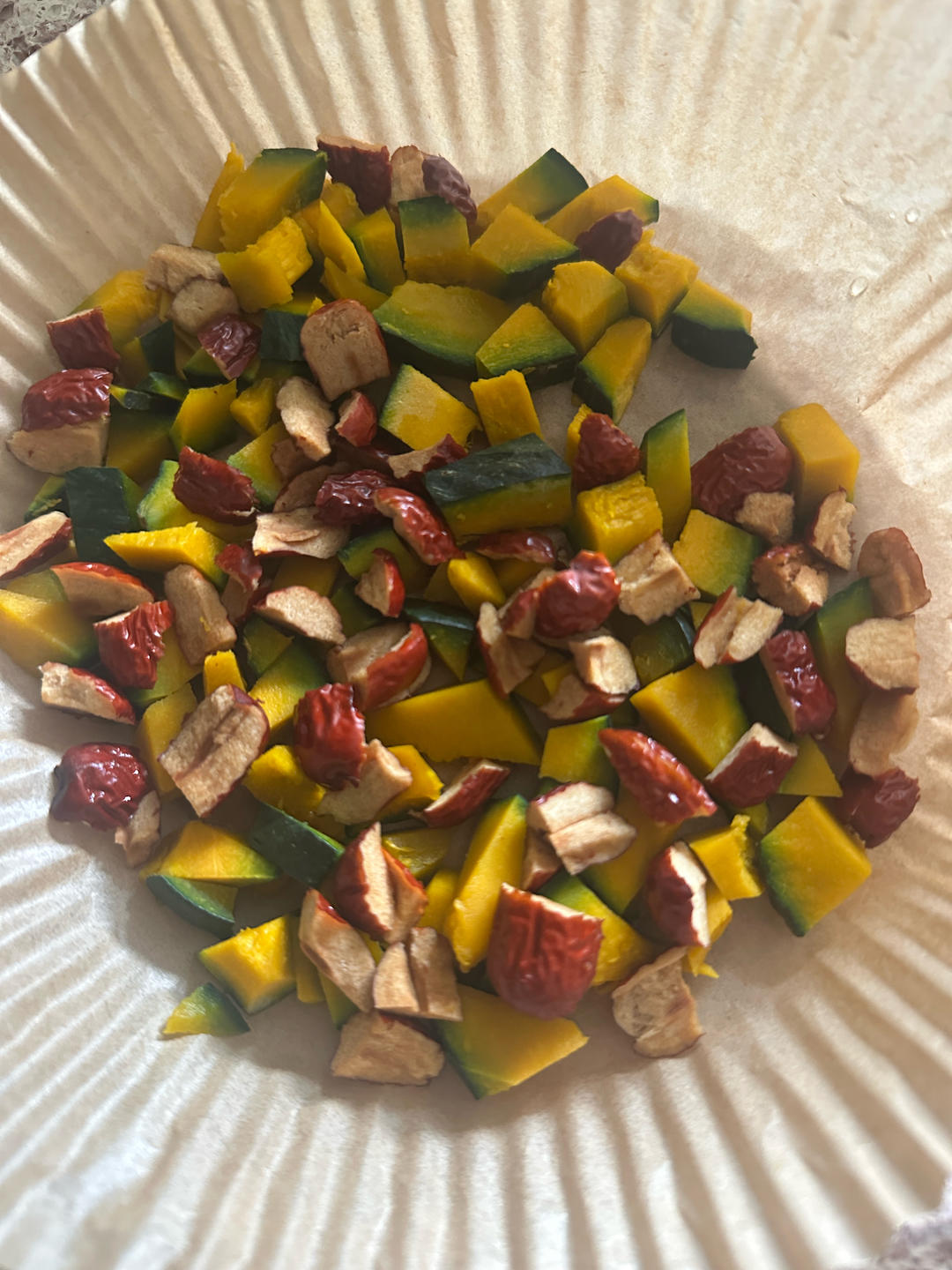 Diced steamed kabocha and red dates ready for the cake