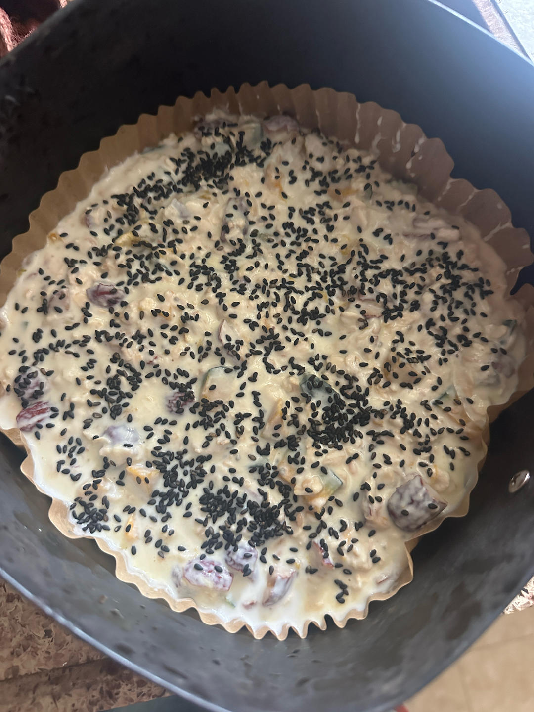 Yogurt and oats stirred into the batter with black sesame on top