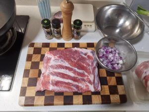 Preparing the rack of ribs on a board