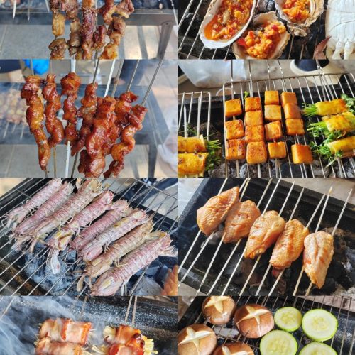 Chinese barbecue skewers cooking over a charcoal grill