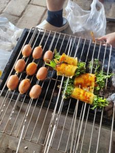 Sausages and tofu skin rolls brushed with oil