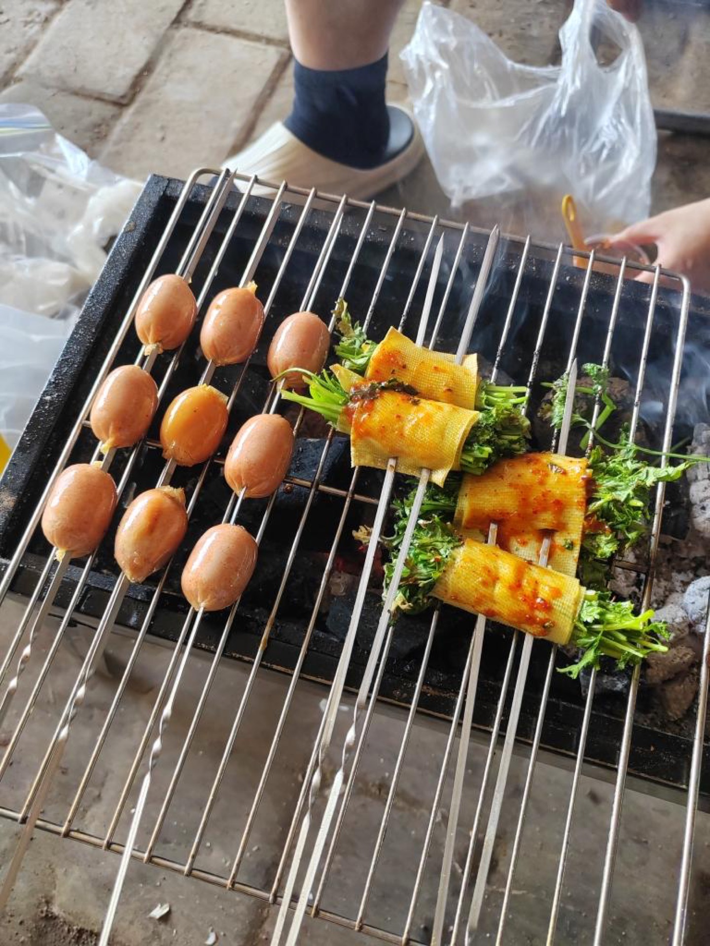 Sausages and tofu skin rolls brushed with oil