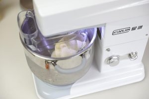 Kneading the butter into the dough on low speed then increasing the speed