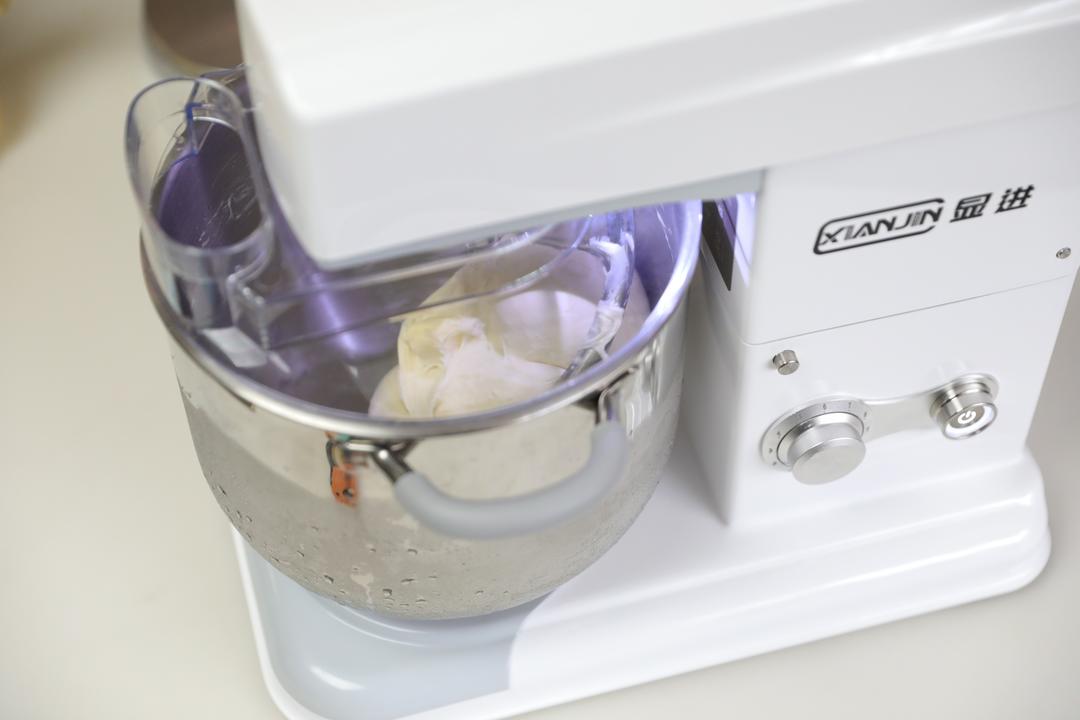 Kneading the butter into the dough on low speed then increasing the speed