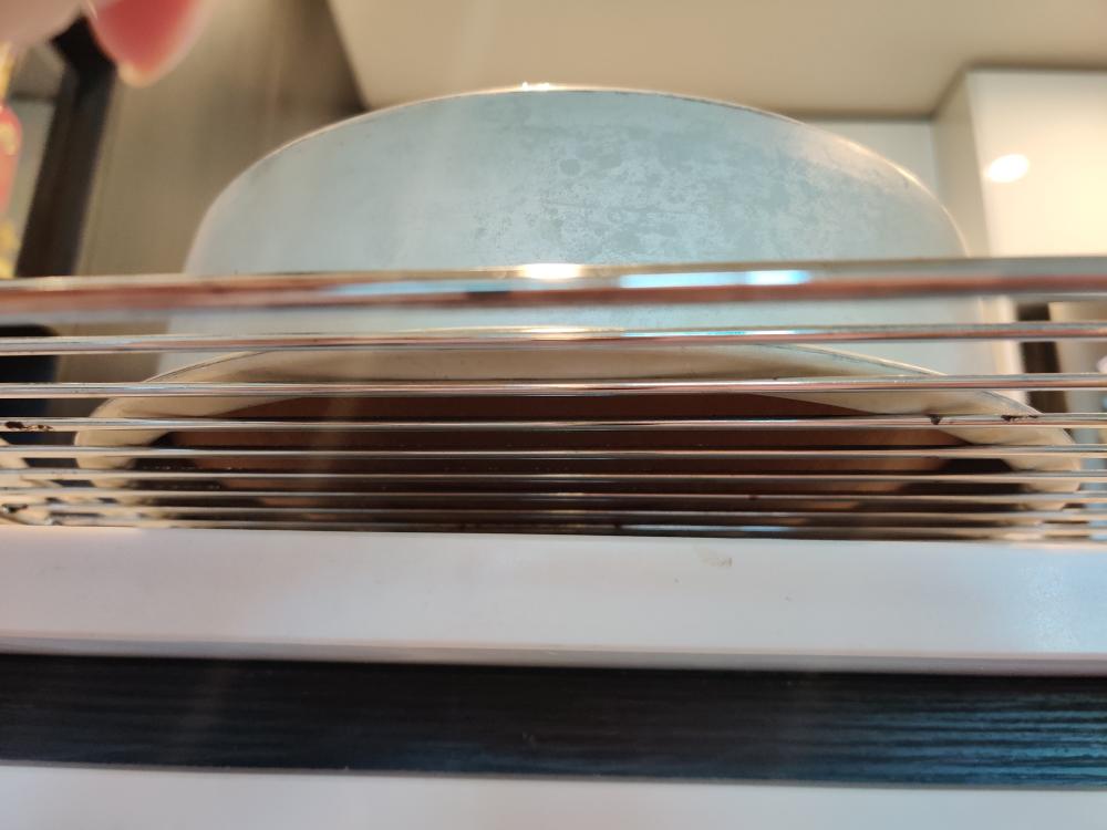 Dropping the hot chiffon pan on the counter to release steam then cooling upside down
