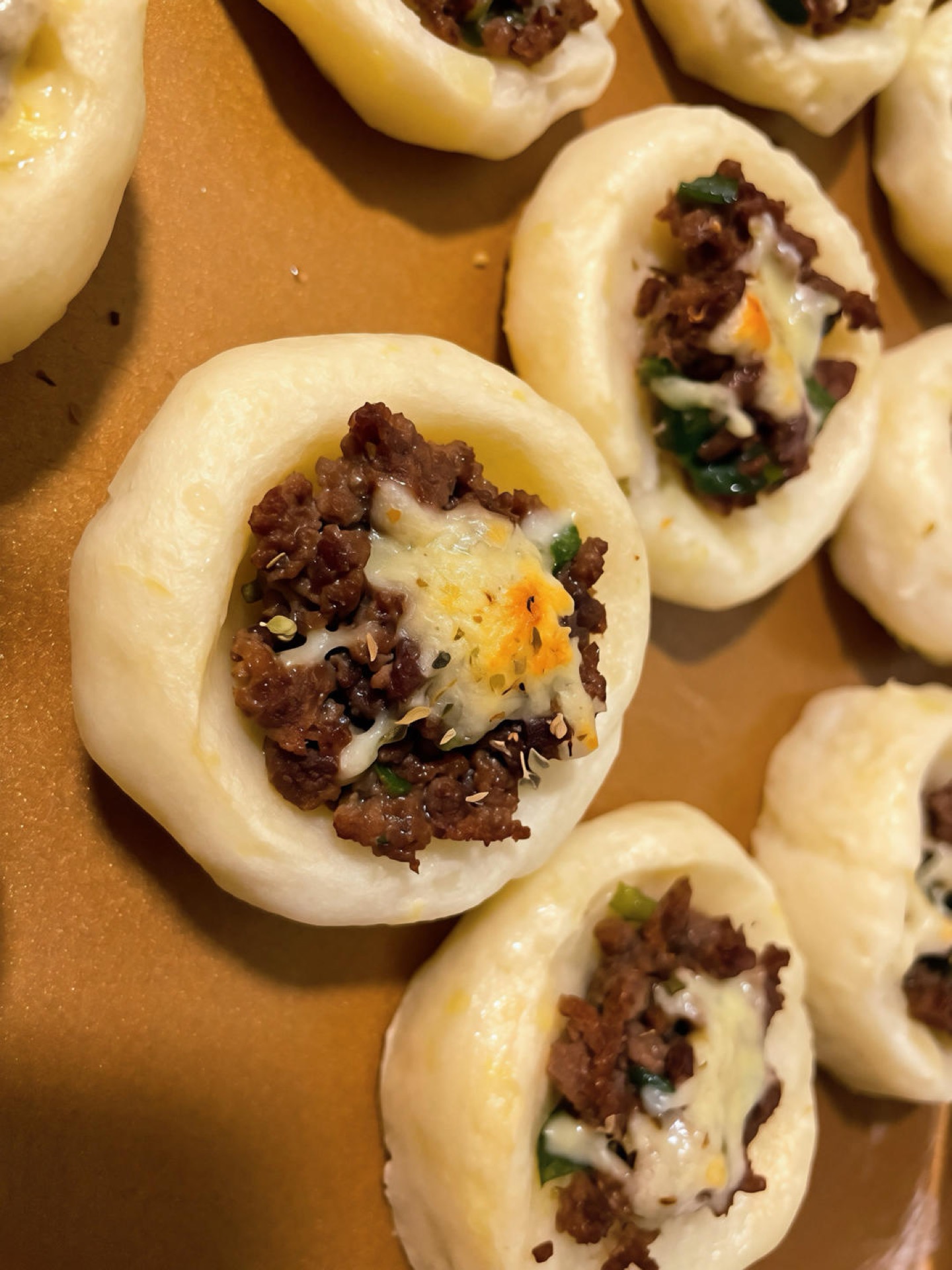 Remove from the oven and serve while the aroma is rich and the cheese is still gooey and warm.