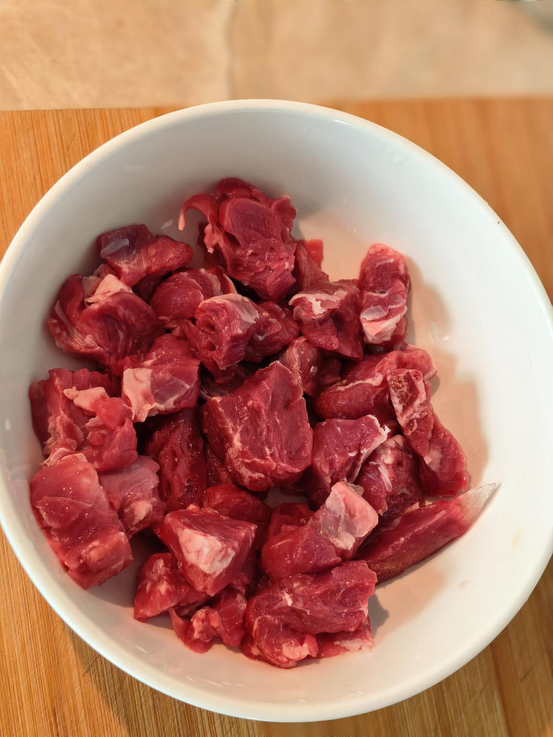 Slicing semi frozen beef tenderloin into thin pieces