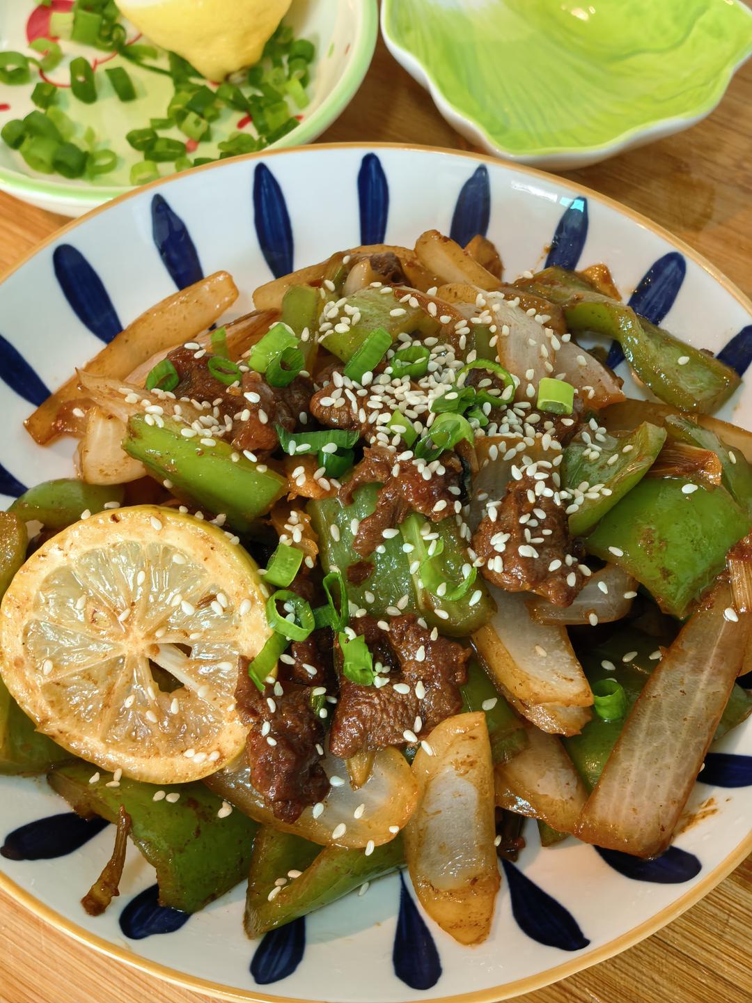Finished glossy beef tenderloin stir fry on a serving plate