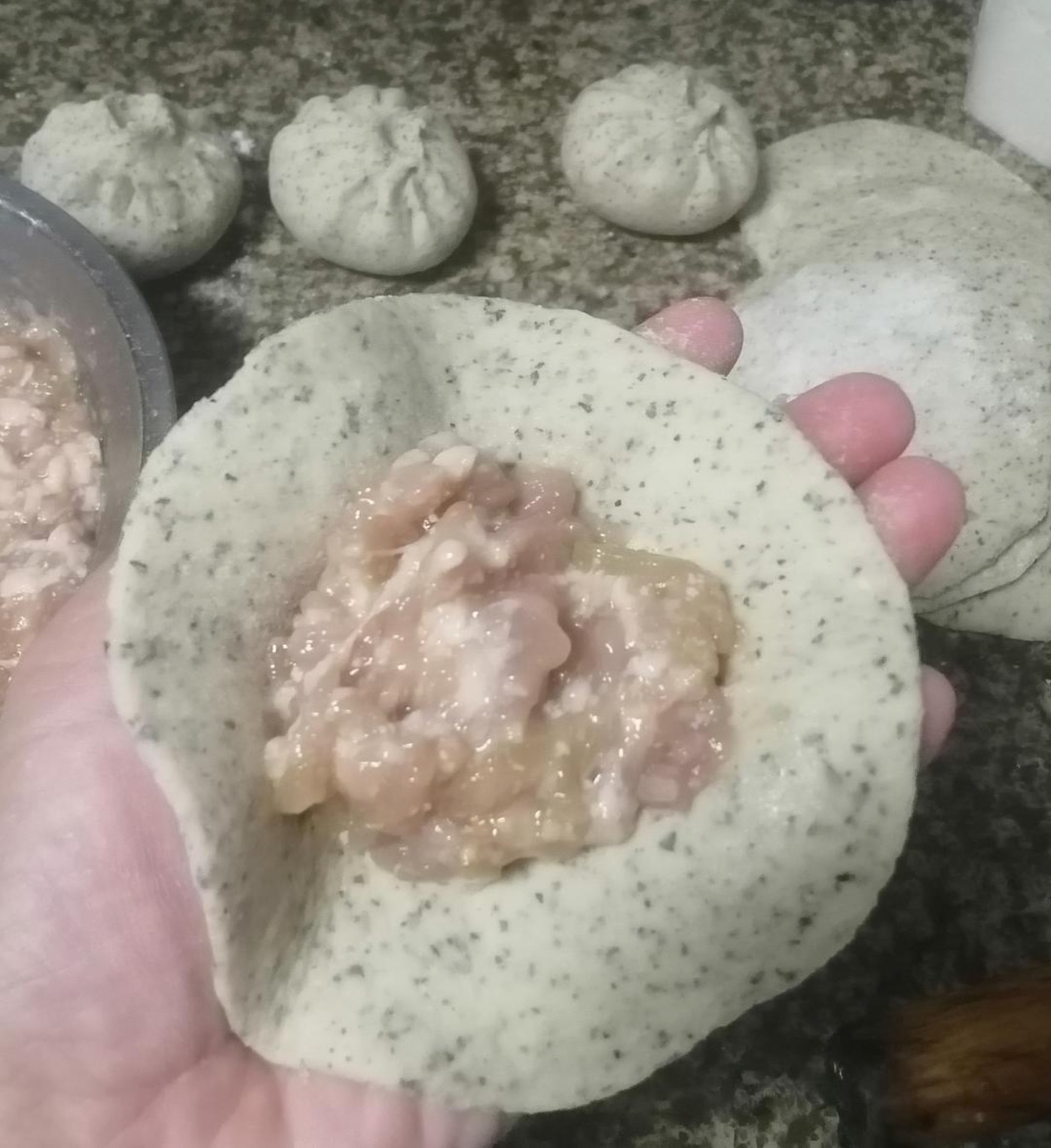 Spoon the pork filling onto each wrapper and pleat the edges closed, pinching firmly to seal.