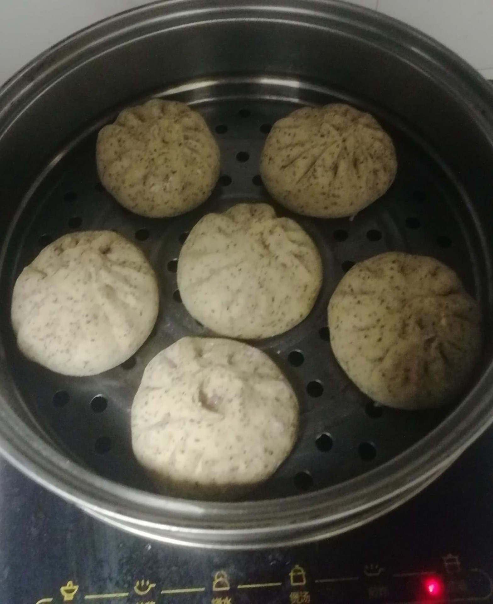 Arrange the buns in a steamer basket and steam over boiling water for 15 to 20 minutes, then rest 5 minutes before uncovering.