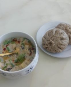 Serve the black bean dregs pork buns hot alongside a cup of savory black soy milk.