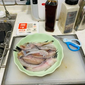 Rinse the Bombay duck well under cold running water, then trim away the fins and the tail.