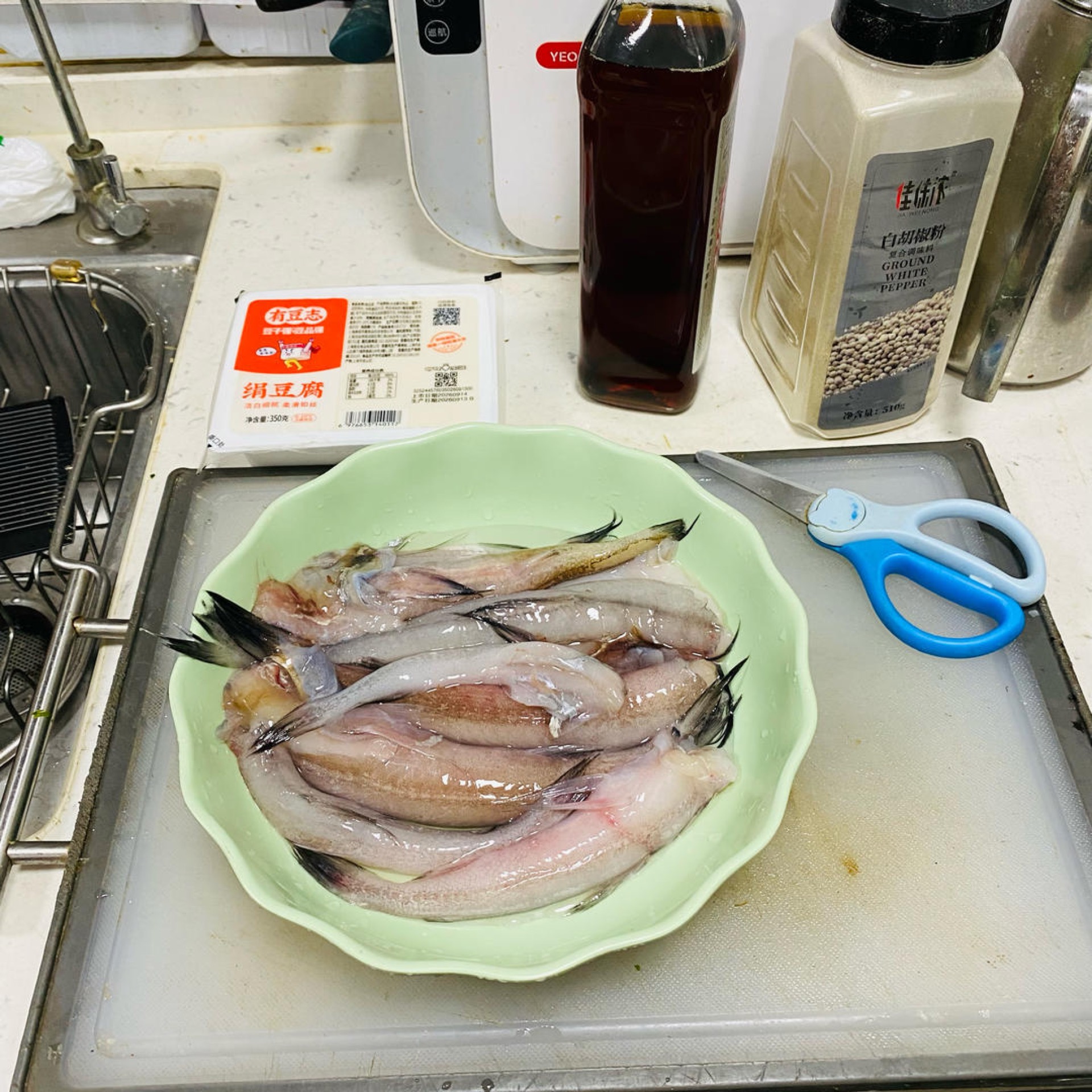Rinse the Bombay duck well under cold running water, then trim away the fins and the tail.