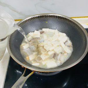 Pour in enough boiling water to cover the ingredients.