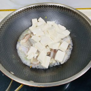 Pour in the tofu cubes.