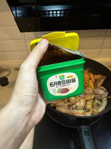 Add the doubanjiang and stir-fry until it smells rich and the oil reddens.