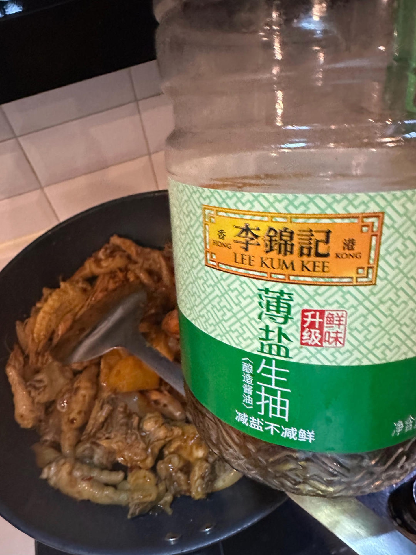 Pour in boiling water to cover the ingredients, then add three tablespoons of light soy sauce.