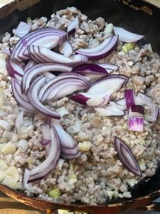 Cook until fragrant, then add the onion.