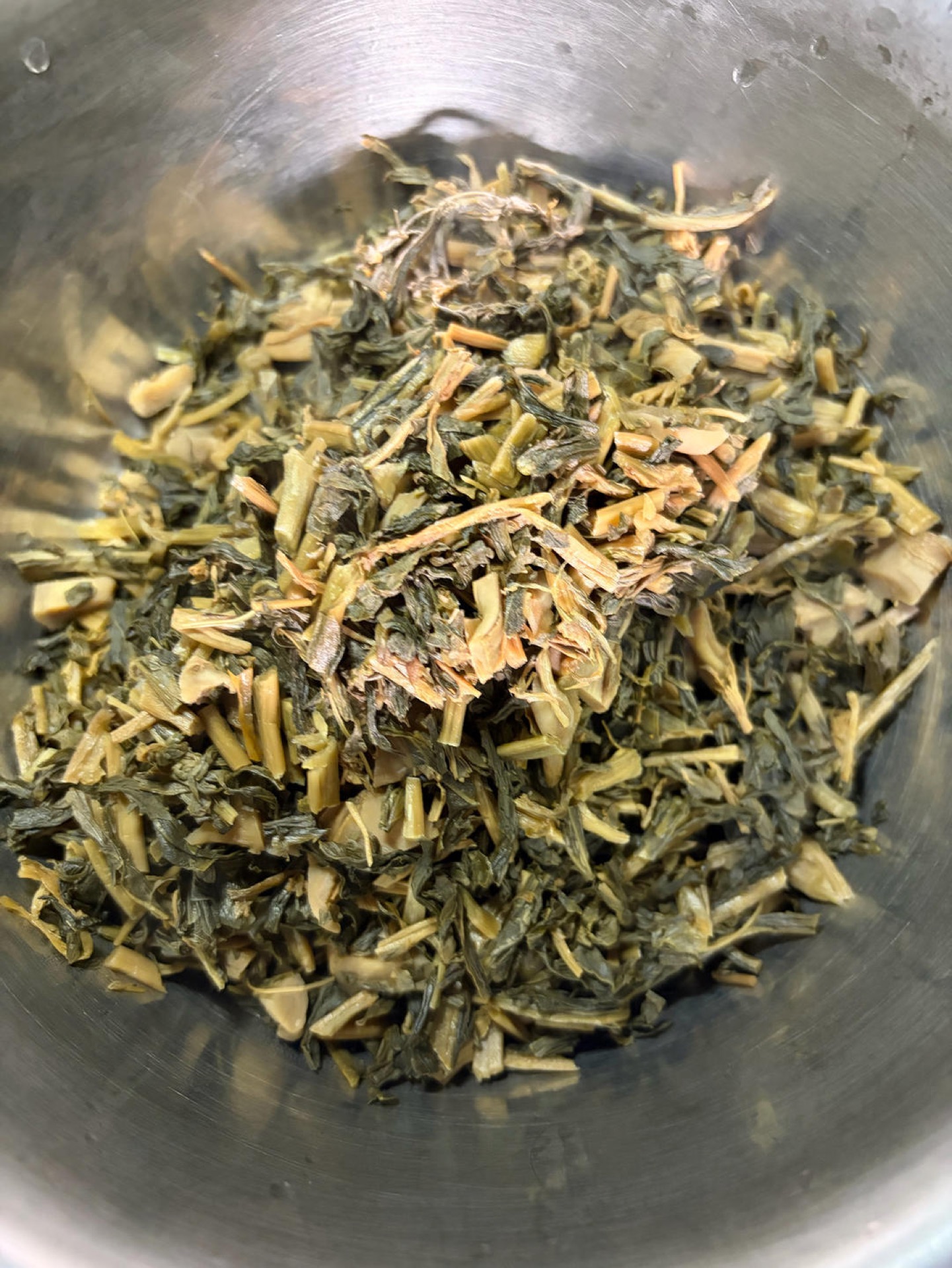 Toasted greens transferred to a plate