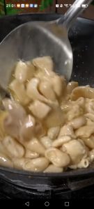 Heat a wok over medium-high heat with a little oil, add the pork intestine, and stir-fry to cook off its excess water.
