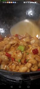 Pour in the light soy sauce, a splash of dark soy sauce, and the Shaoxing rice wine to lift the gamey note.