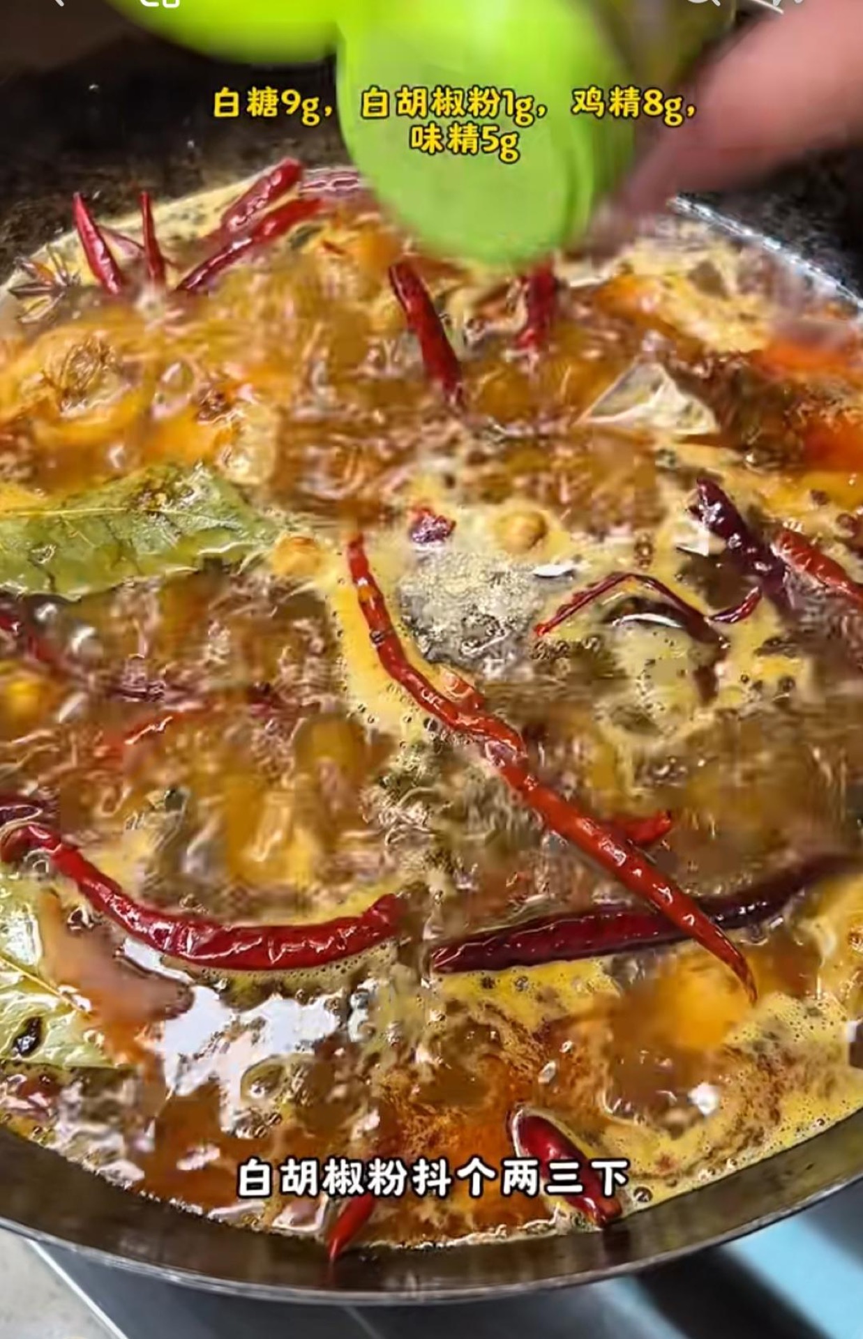 Adding water and seasonings to the wok