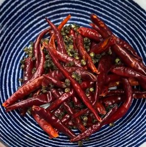 Soaking dried chilies and Sichuan peppercorns