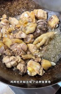Adding dried chilies and peppercorns to the wok