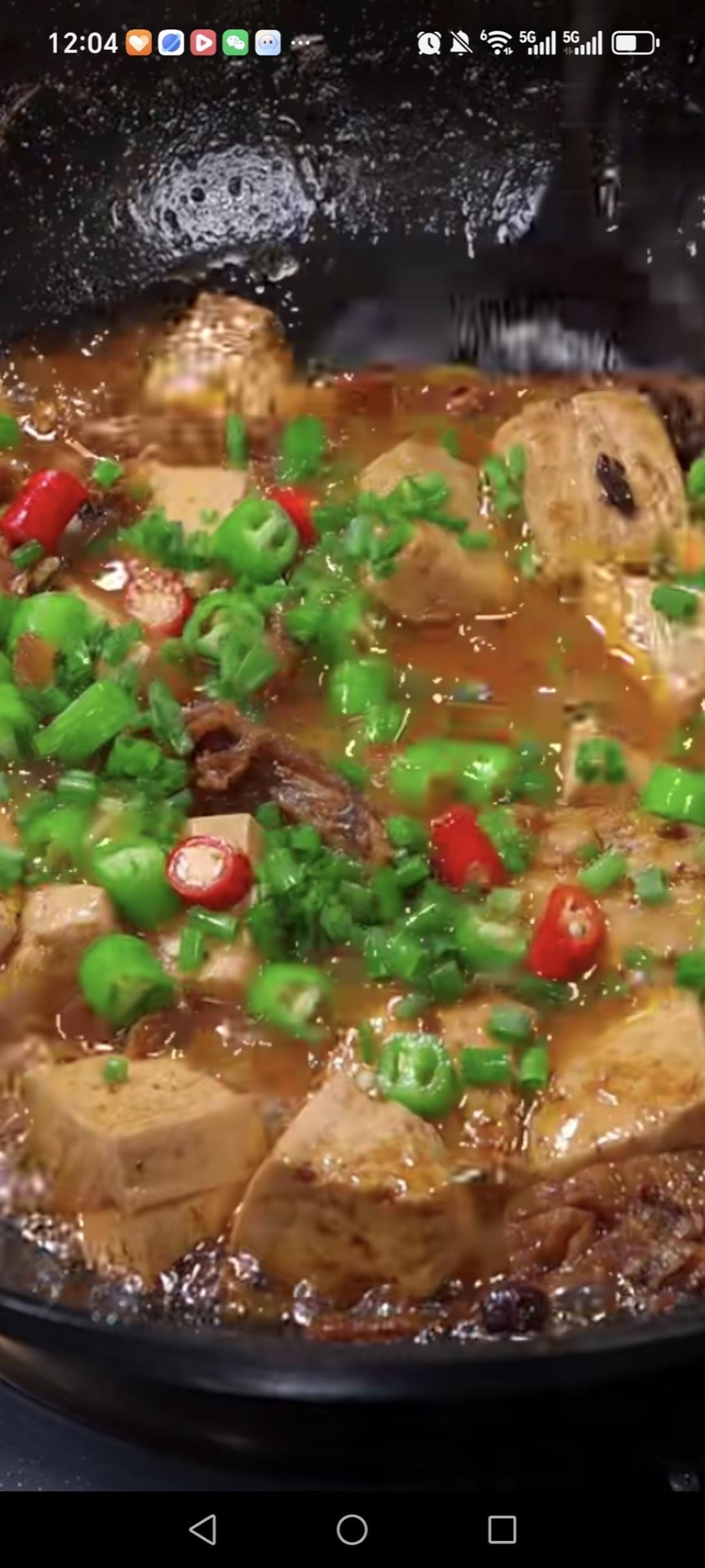 Scatter over the sliced fresh chilies and sliced scallions.