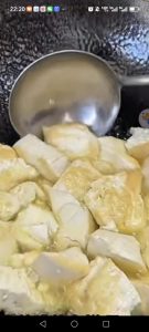 Fry the tofu until golden on both sides, then scoop it out and set it aside.