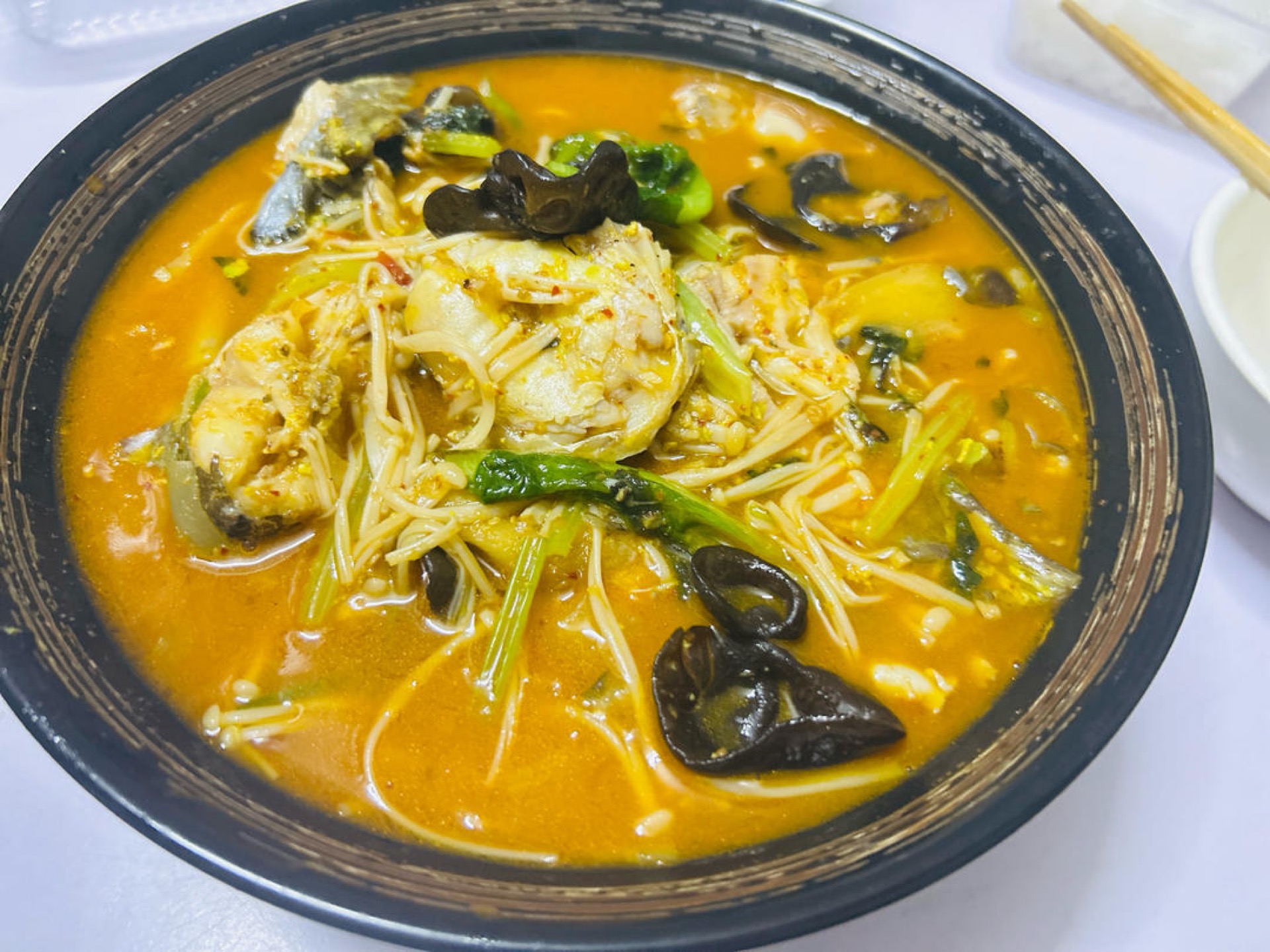 Braised yellow catfish with perilla in a dark glossy sauce