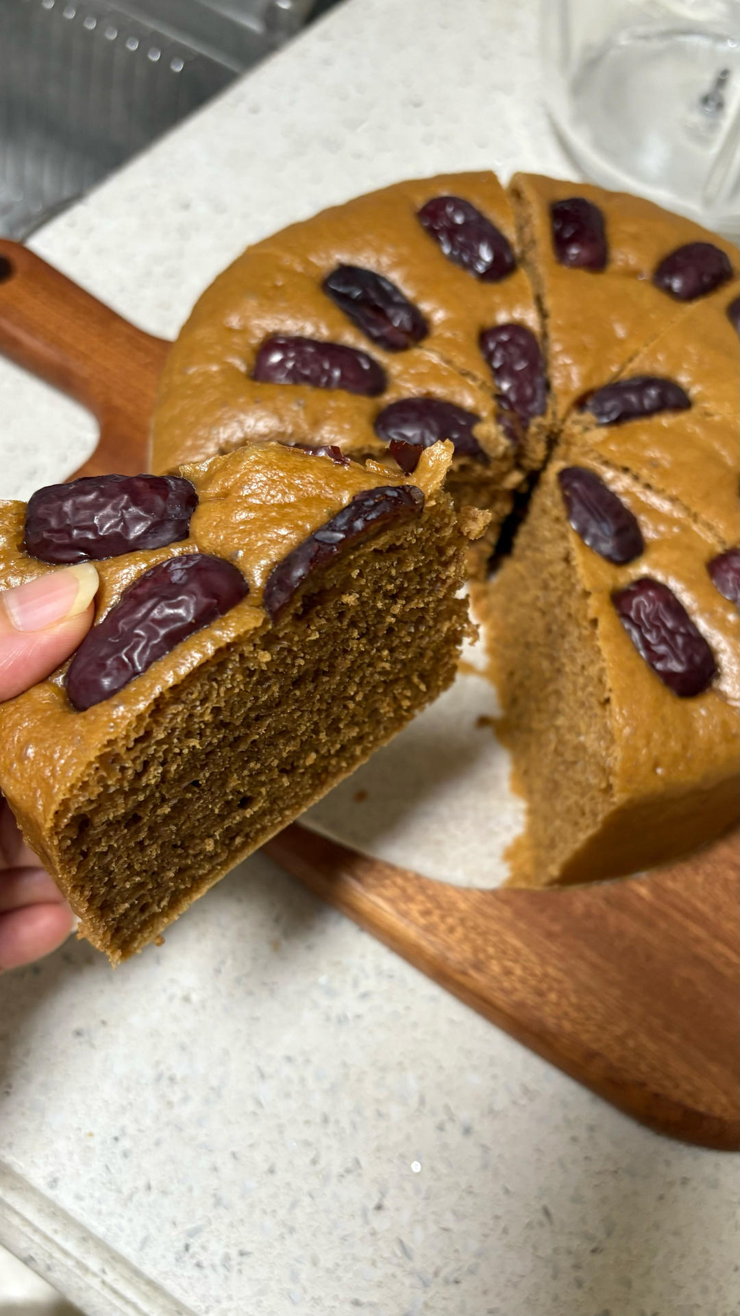Brown sugar cake sliced to show its soft springy crumb