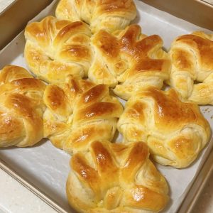 Soft pull-apart butter bread buns baked golden on a tray