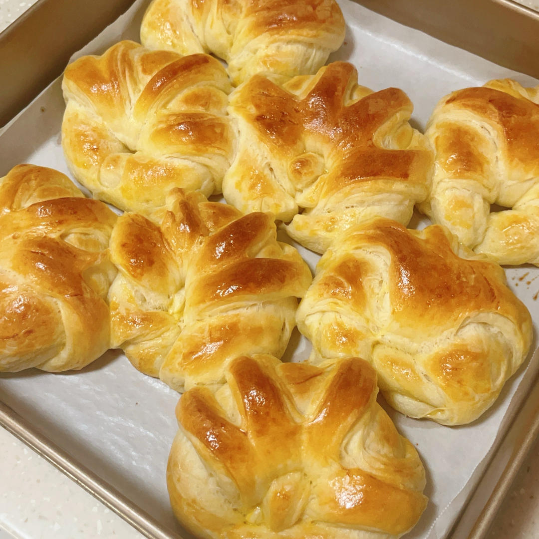 Soft pull-apart butter bread buns baked golden on a tray