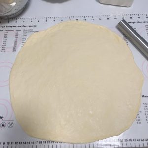 Rolling the dough into a thin even sheet