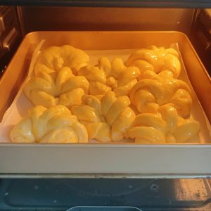 Baking the butter bread buns until golden